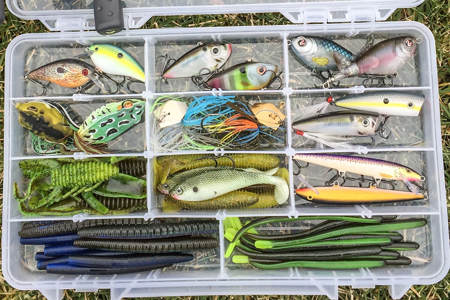 tackle organizer with various fake fishing lures and baits