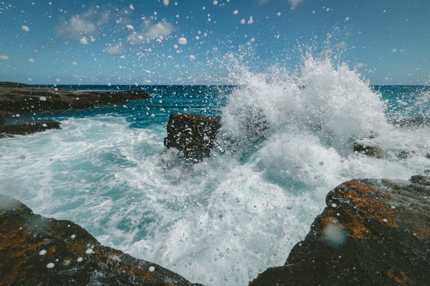 Ocean waves crashing against rocky shore