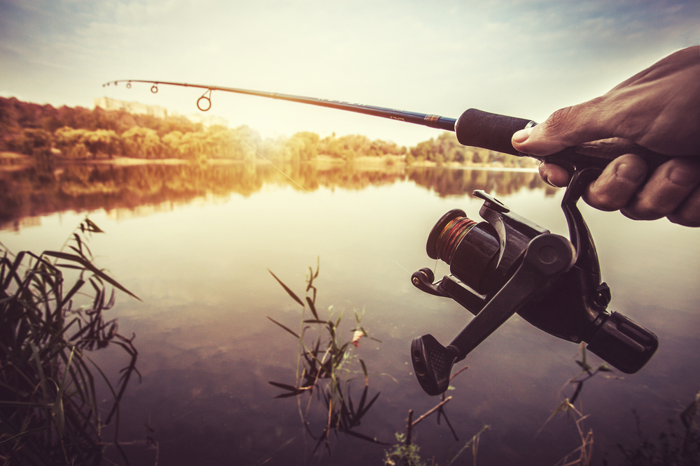 Man in equipment fishing on the lake