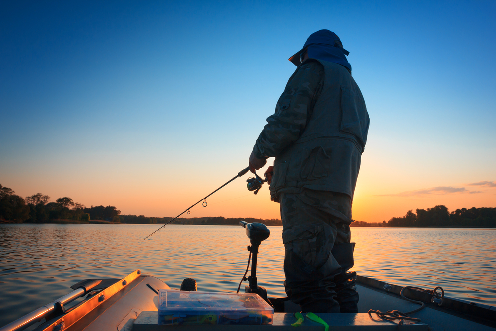 Biggest bass fishing myths - a man fishing in a boat. 