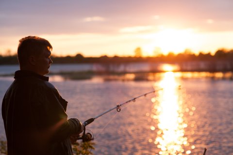 Man fishing on the shoreline