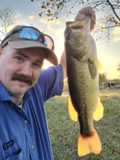William Vest Bassforecast customer holding up a largemouth Bass